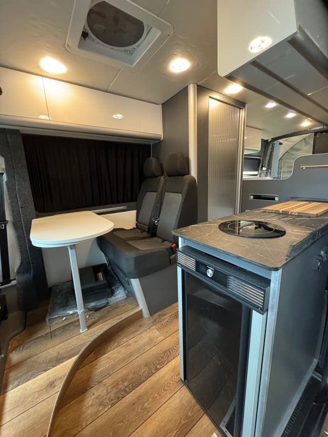 Finished van interior with kitchen and seating