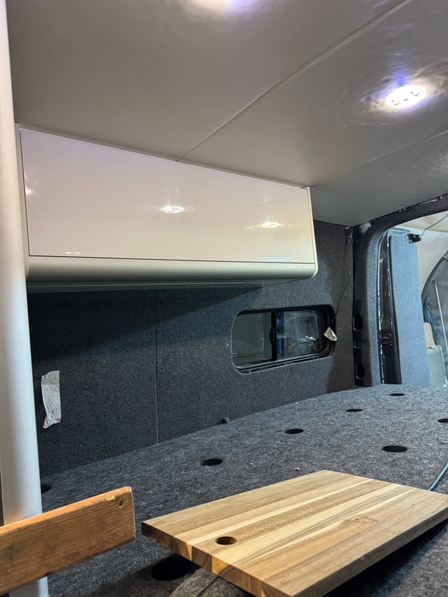 Camper van side cabinet and fitted window